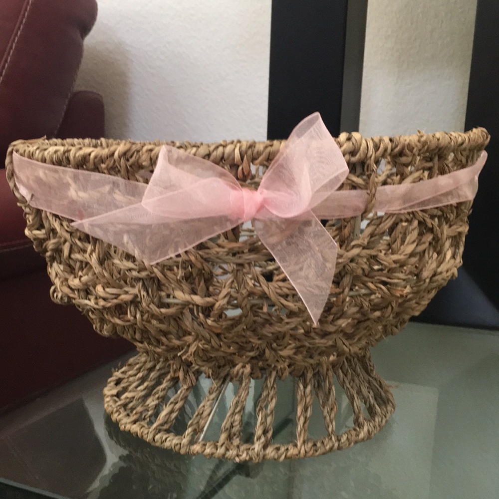 Beautiful wicker handmade basket with a pink bow 6.5”tall and 11”diameter